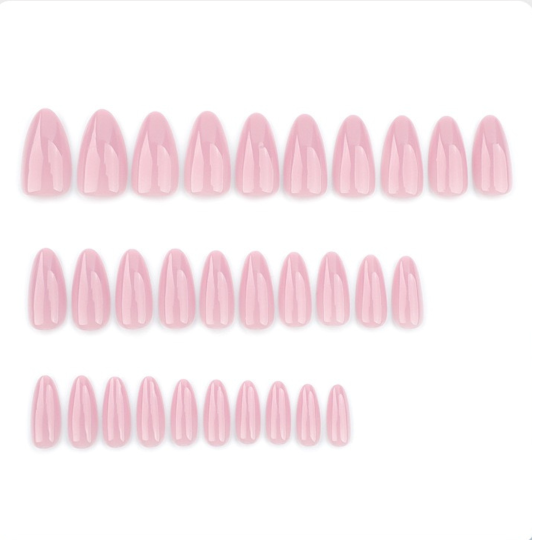 Set of pink nail polish strips on a white background