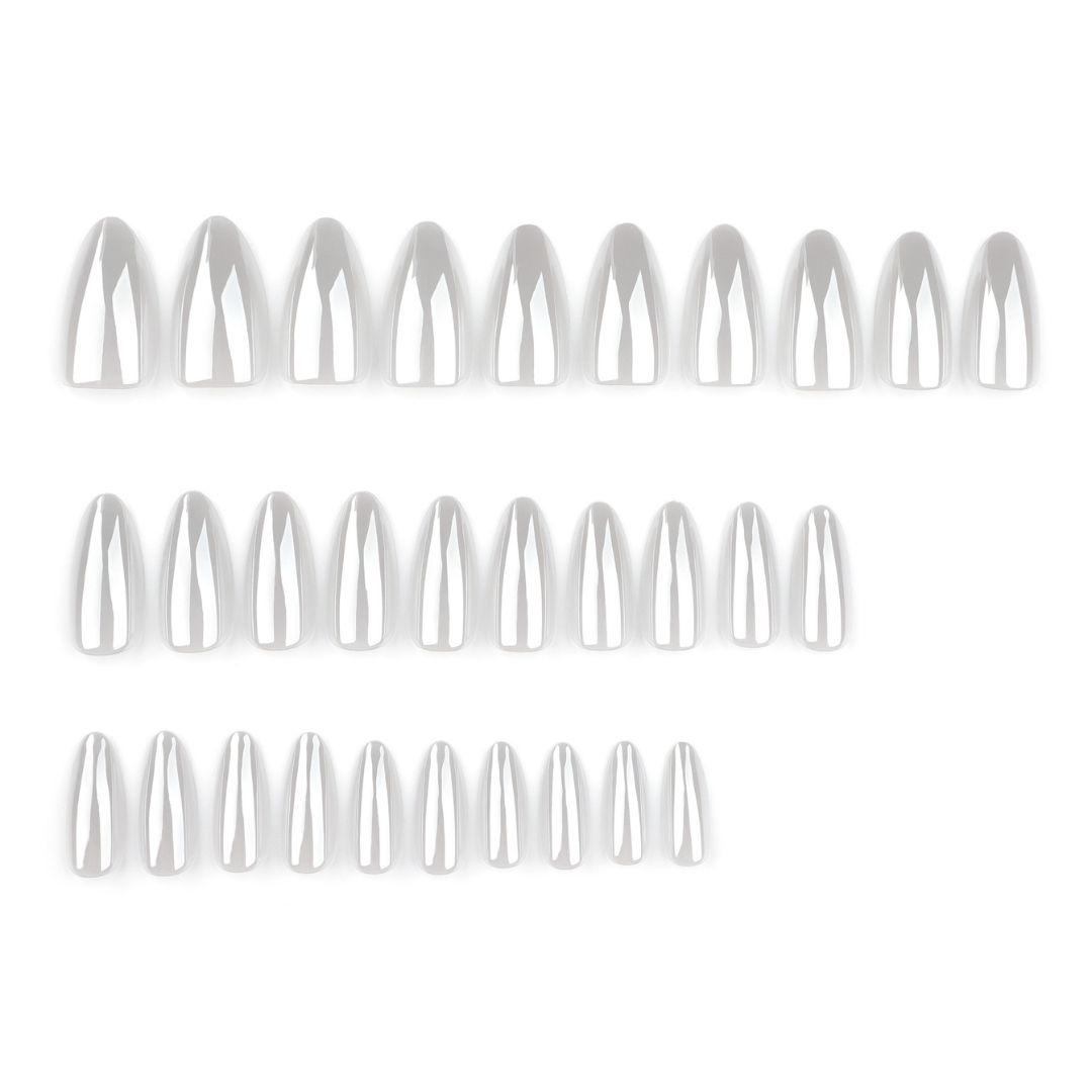 Set of white nail extensions on a white background
