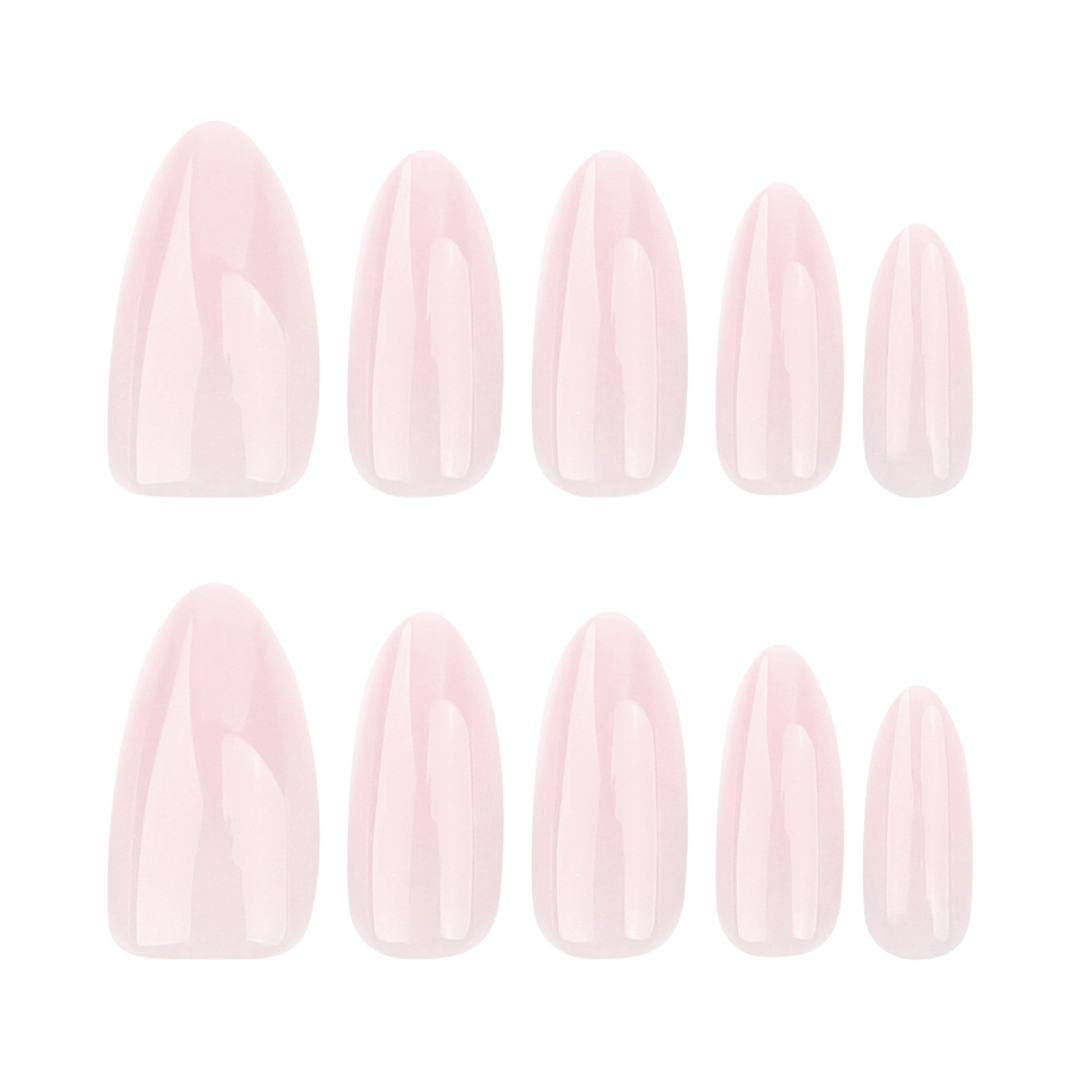 Set of light pink nail extensions on a white background