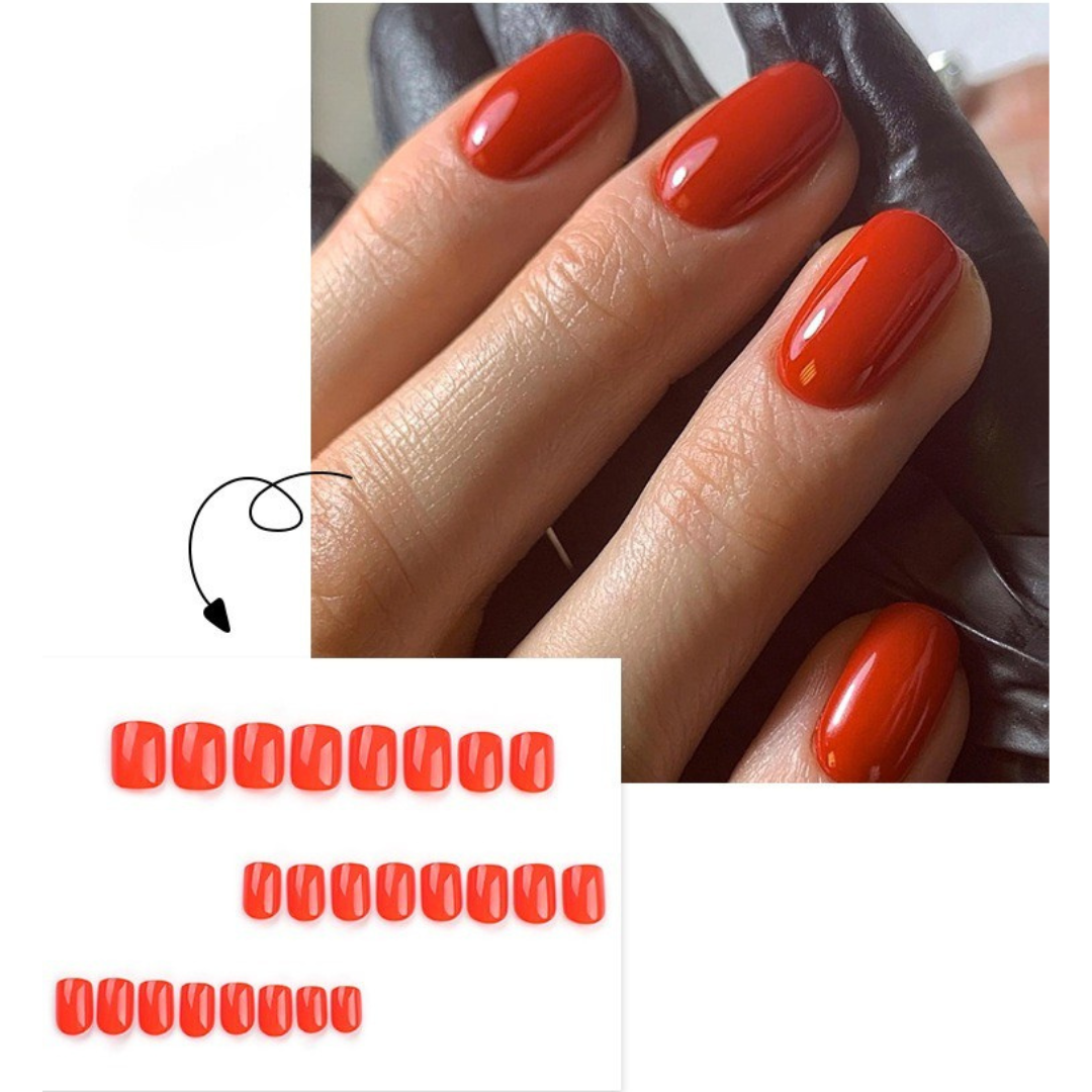Close-up of a hand with red nail polish on a white background