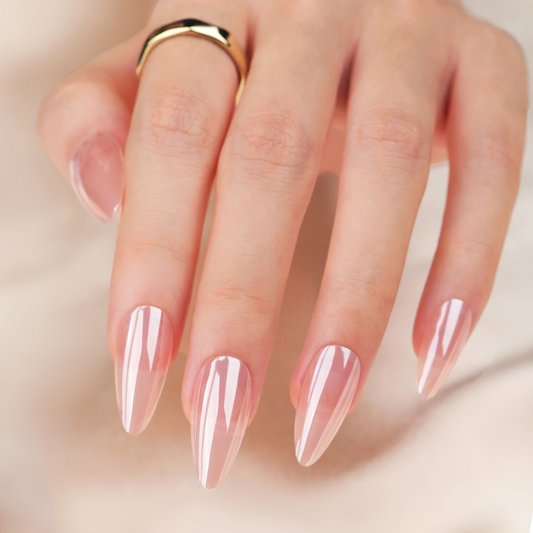 Hand with pink and white gradient nail polish on a neutral background