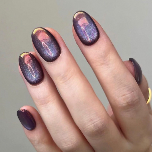 Nail art with a gradient design on a neutral background