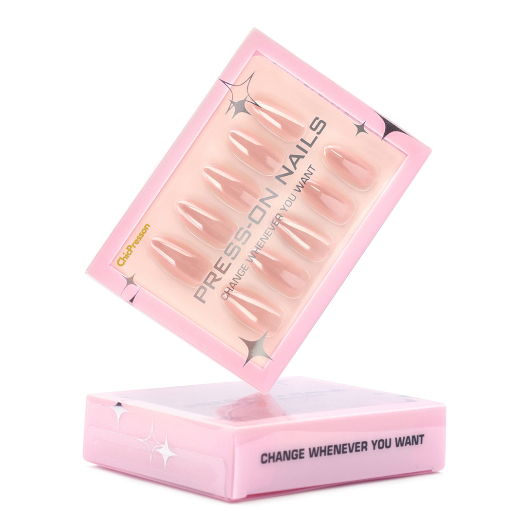 Pink packaging of press-on nails with a white background