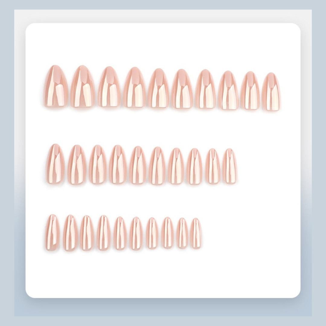Set of rose gold nail extensions on a white background