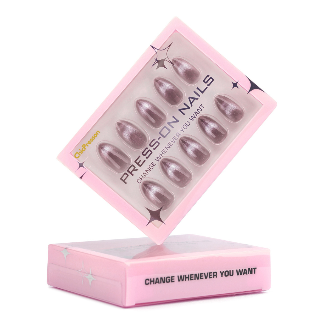 Pink box of press-on nails with visible text on a white background