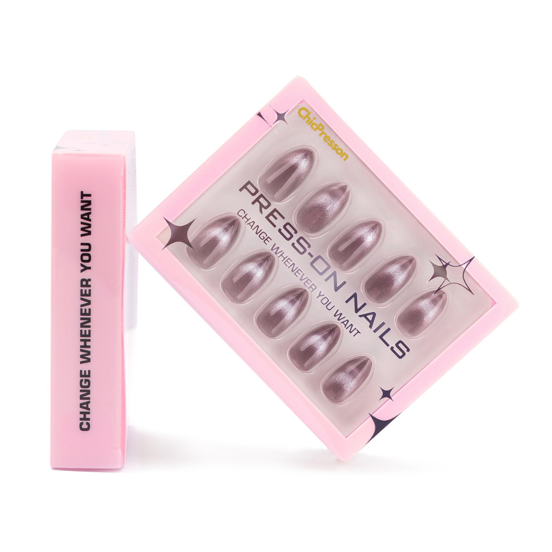 Pink box of press-on nails with a pink applicator on a white background