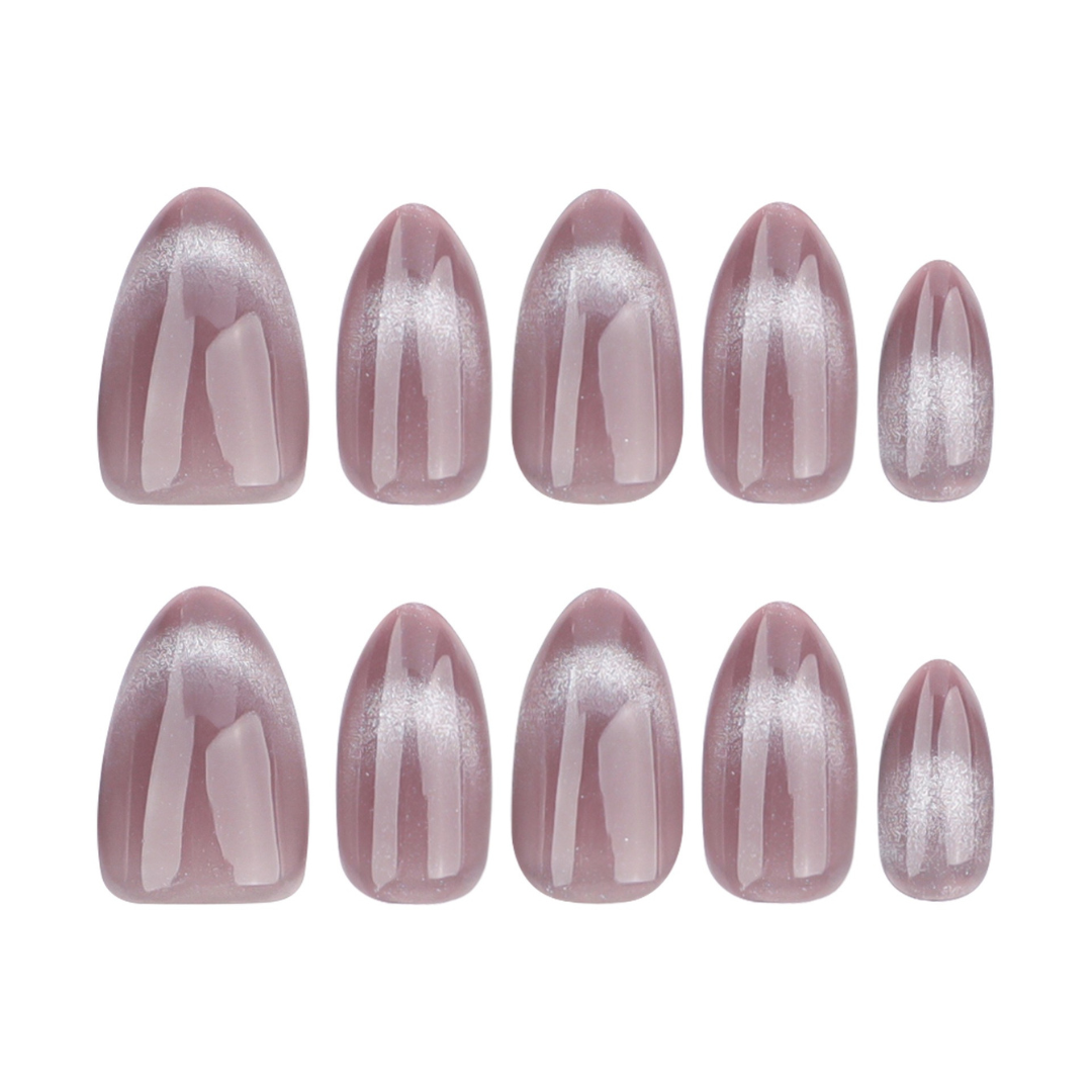 Set of pink nail extensions with a glittery finish on a white background