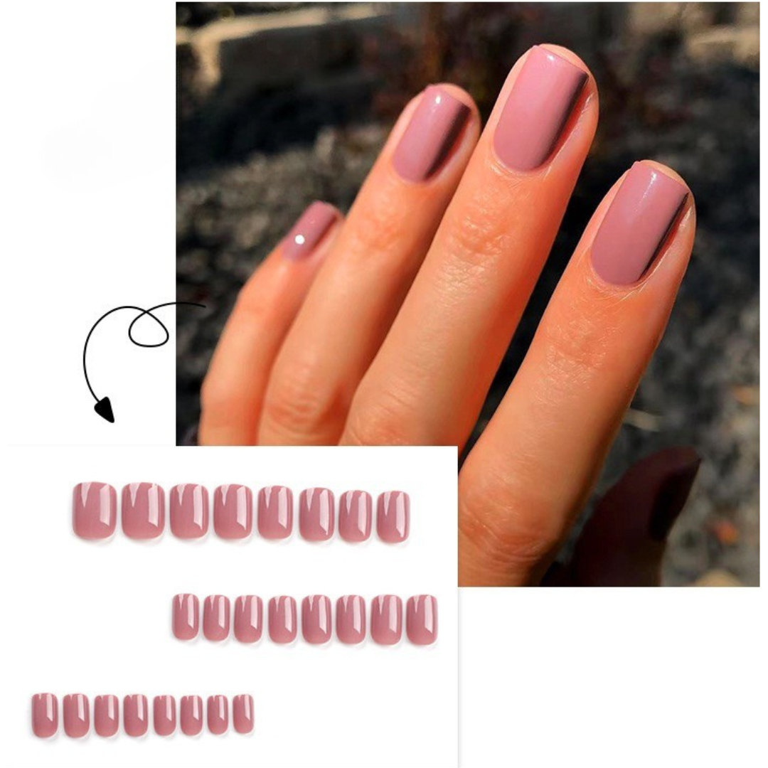 Close-up of a hand with pink nail polish and a blurred background