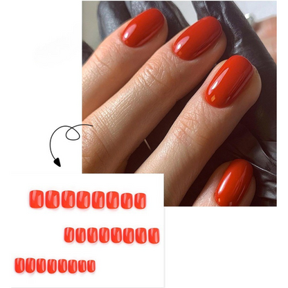 Close-up of a hand with red nail polish on a white background