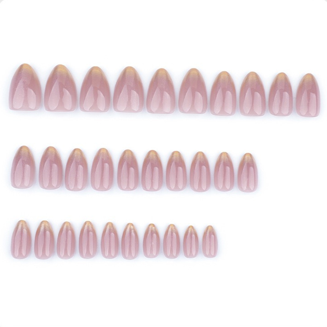 Row of pink nail extensions on a white background