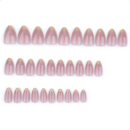 Row of pink nail extensions on a white background